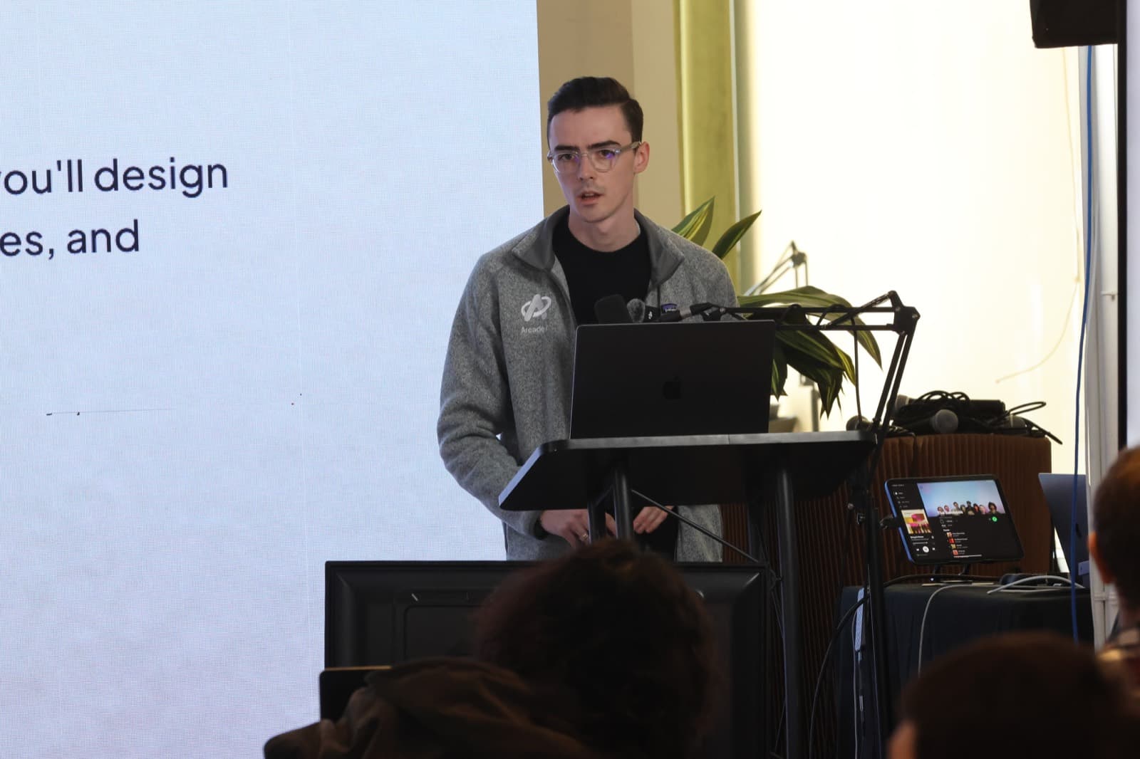 Remi giving a talk at a hackathon